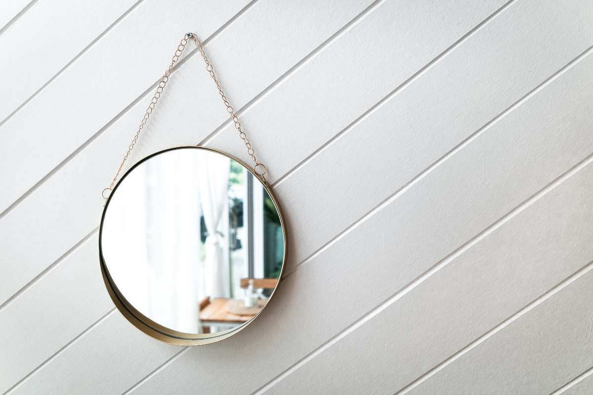mirror hanging on wall